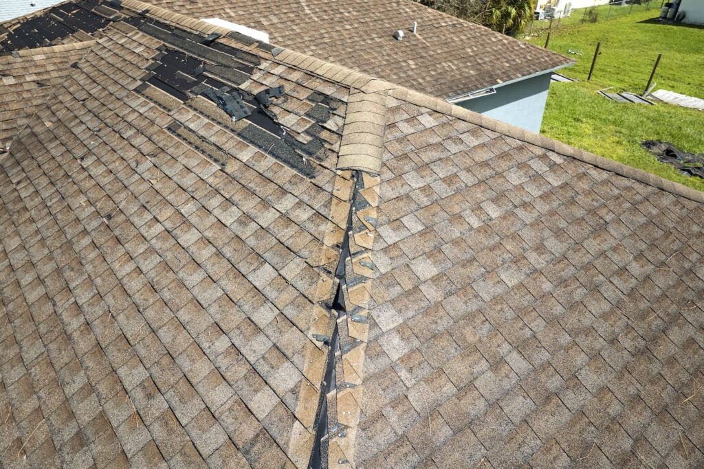 Commercial Storm Damage Restoration: Houston’s Reliable Roofing Experts 7 damaged house roof with missing shingles after hur 2023 08 26 09 24 27 utc copy